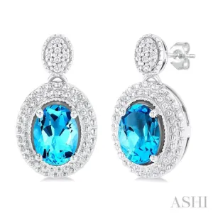 7X5 MM Oval Cut Blue Topaz and 1/20 ctw Round Cut Diamond Semi Precious Earring in Sterling Silver