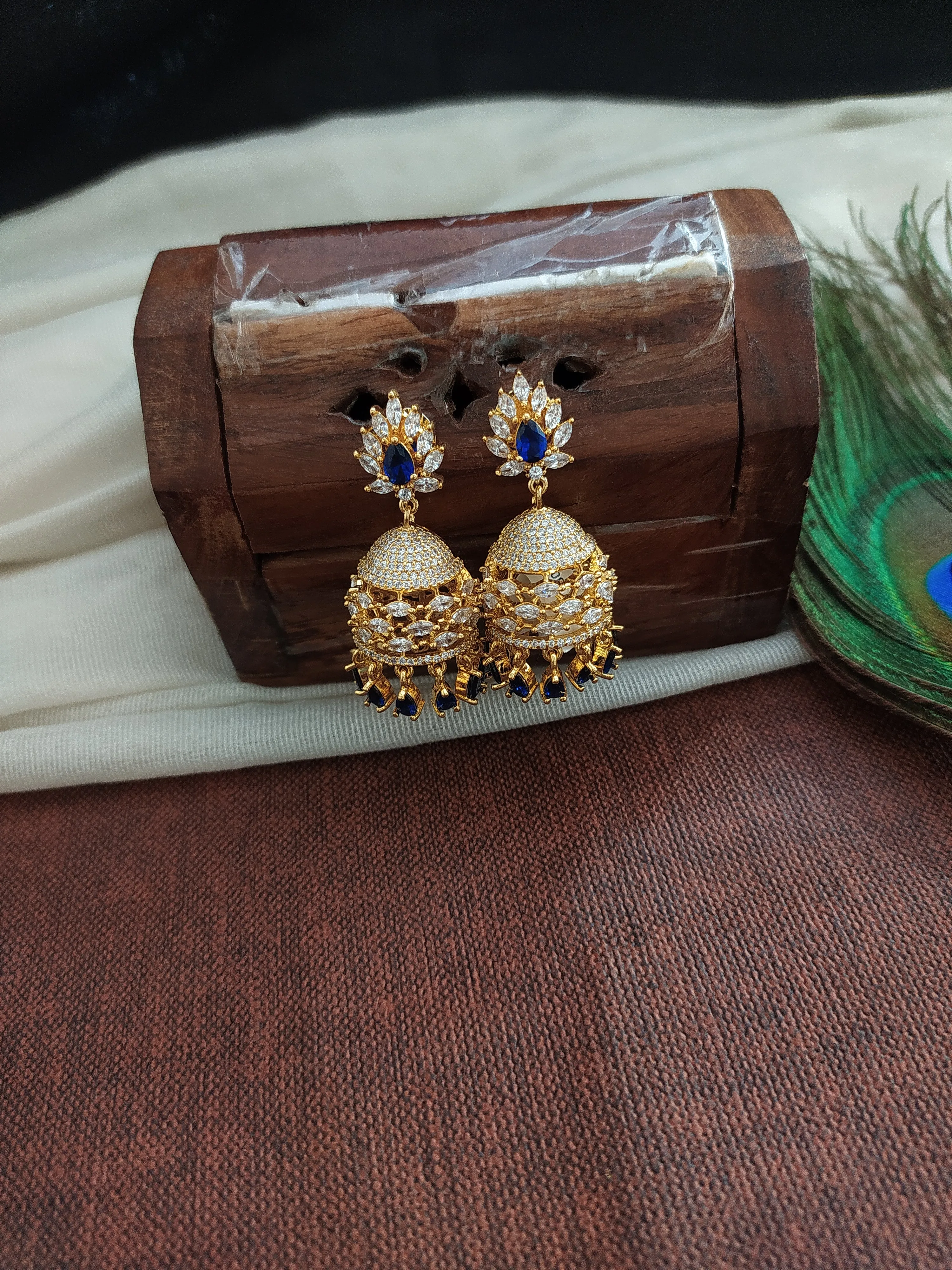 Eye Catching Gold Plated Jhumka With Zircon Stones With pearl Dangling