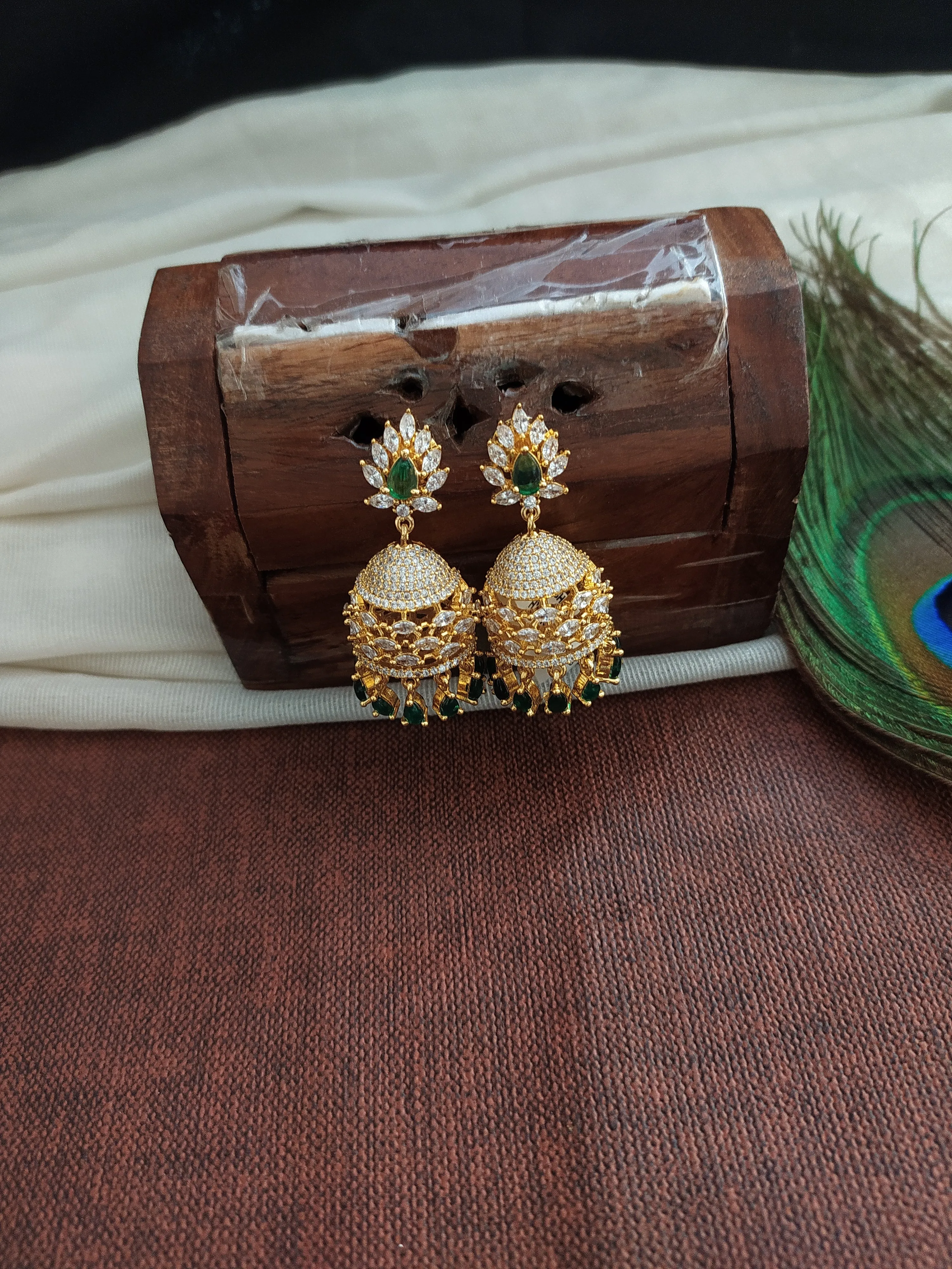 Eye Catching Gold Plated Jhumka With Zircon Stones With pearl Dangling