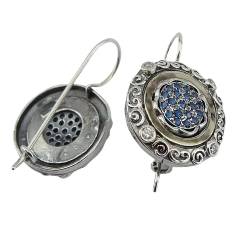 Oriental style silver and gold dangle earrings, decorated with blue Zircon