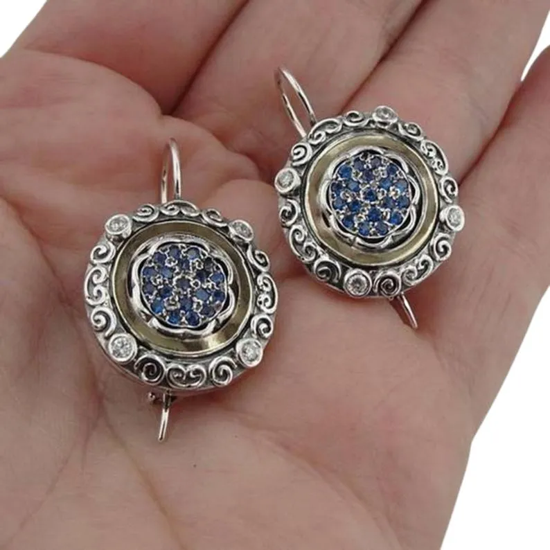 Oriental style silver and gold dangle earrings, decorated with blue Zircon